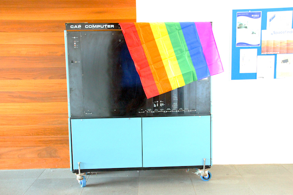 LGBTQ+ flag and computer