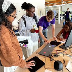 Visitors to the Intel Lab could try some fun computer science-related activities like digital air hockey and lock-picking