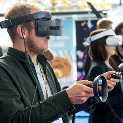 Image of attendee at Virtual Reality event. Image by Unsplash.